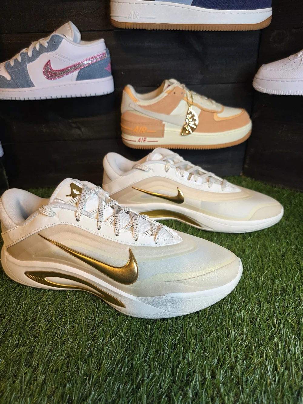 Nike Women's White Sneakers with Gold Swoosh